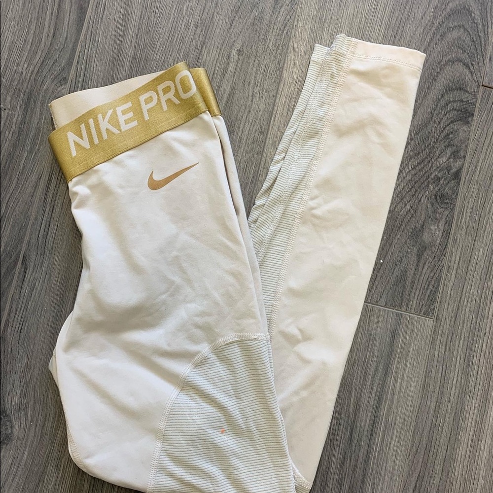 Gold Nike Pro Fleece Lined Leggings